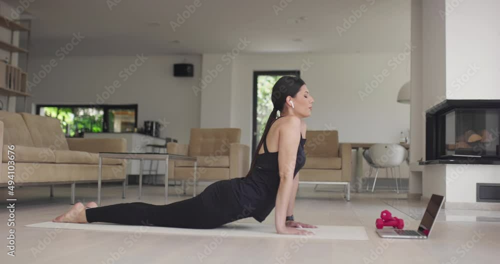Beautiful Girl Using Smartphone after Fitness Workout at Home. Determined Plus Size Woman Using Fitness Tracker, Yoga Exercises Application, Browsing Online Health Articles, Posting on Internet Beautiful Girl Using Smartphone after Fitness Workout at Home. Determined Plus Size Woman Using Fitness Tracker, Yoga Exercises Application, Browsing Online Health Articles, Posting on Internet