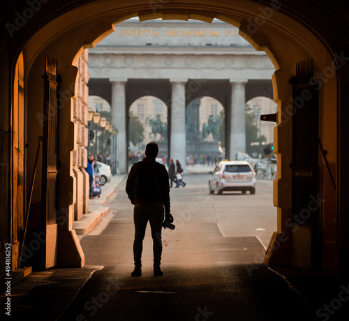Vienna, Austria: silhouette of a photographer in the city center at Hofburg entrance arch © Agata Kadar