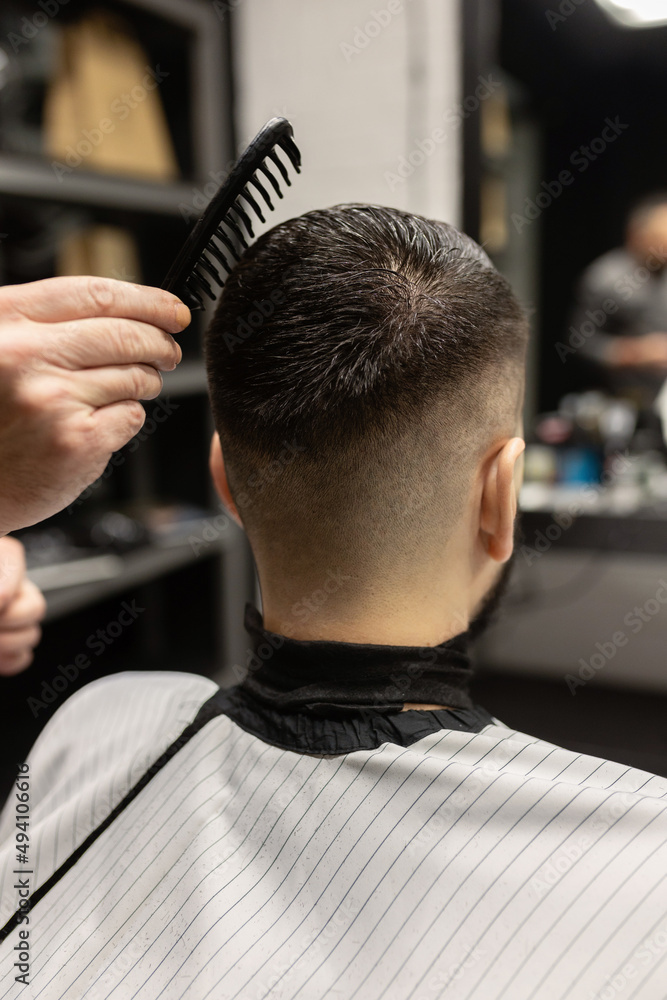 Man getting a haircut. Barber. men's haircut