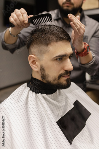 Man getting a haircut. Barber. men's haircut