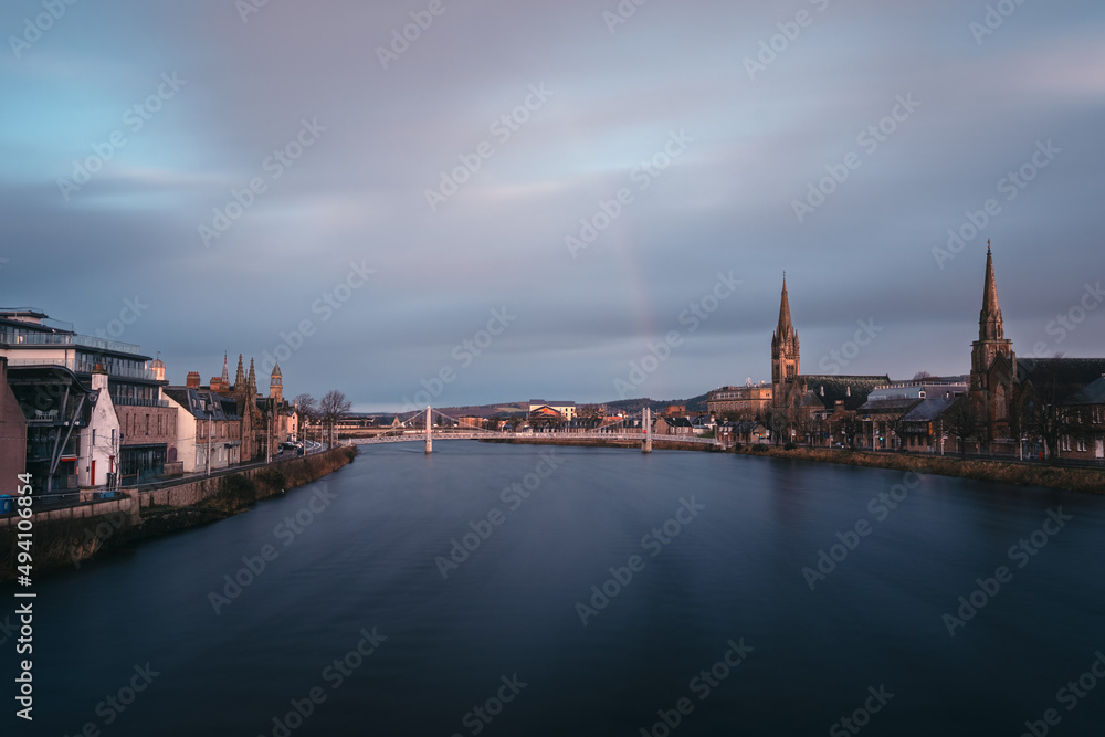 Beautiful cityscape of morning city and river with rainbow. River Ness, Inverness, Scotland
