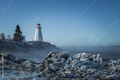 Green's Point Lighthouse in L'Etete Saint George New Brunswick Canada - Winter frozen landscape cold