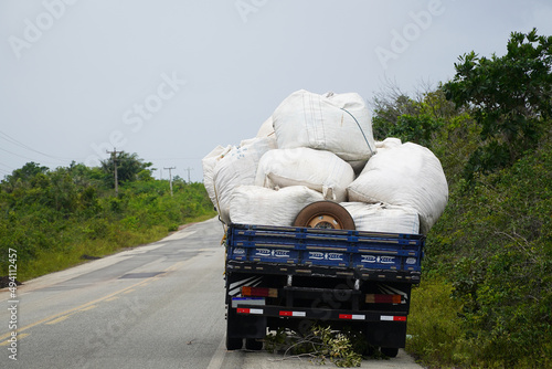 Wallpaper Mural Load securing. Broken truck in which the load of heavy plastic bags was inadequately secured. The load has slipped, continuing the journey would be irresponsible without further consequential damage.  Torontodigital.ca