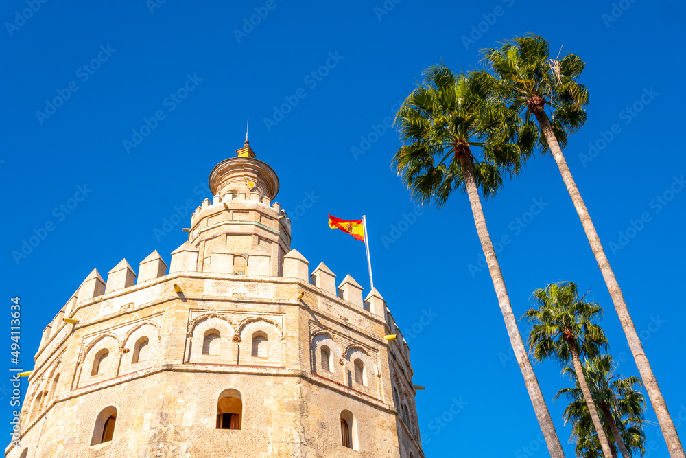 The Torre del Oro Watchtower on the banks of the Guadalquivier River in Seville, Spain.	