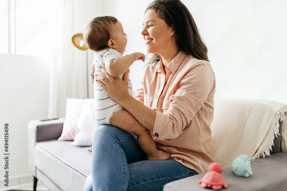 Mother and her baby son playing at home Mother and her baby son playing at home