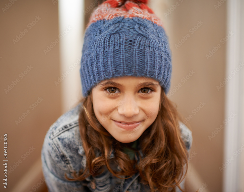 Time for some vacation fun. Shot of a young girl posing in her woolen hat indoors. Time for some vacation fun. Shot of a young girl posing in her woolen hat indoors.