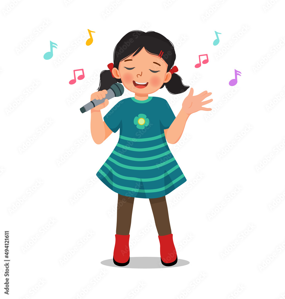 happy little girl singing a song with a microphone