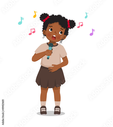 cute little African girl singing a song with a microphone