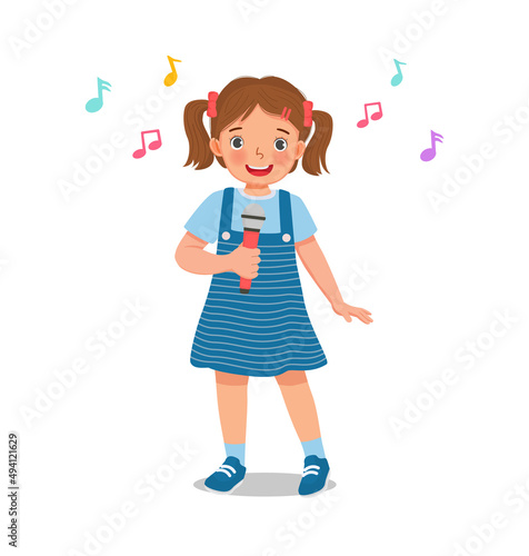 cute little girl singing a song with a microphone