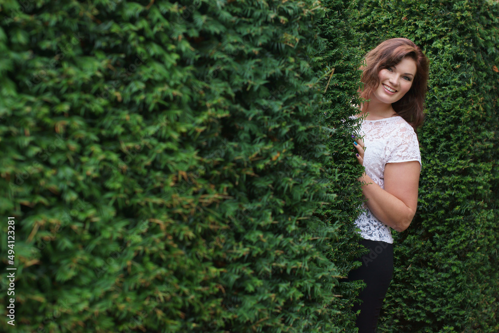 Playful in the park. Shot of an attractive young woman enjoying a day in the park. Playful in the park. Shot of an attractive young woman enjoying a day in the park.