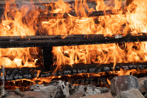 Fire flames engulfing burring wood pallet