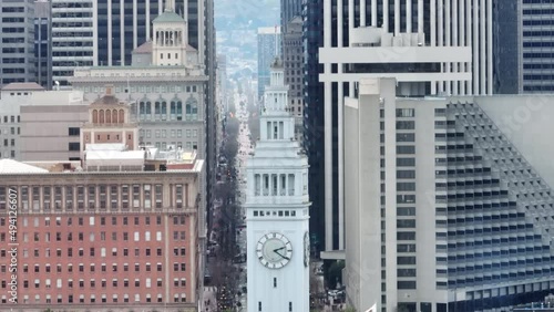 4K Aerial San Francisco cityscape closeup with white tower of Ferry Terminal USA photo