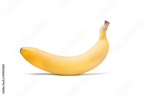 One ripe yellow banana isolated on a white background