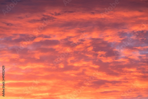 Bright orange, pink sunset sky. Great for replacement in photo editing for dramatic, epic scenic view.  © Scalia Media