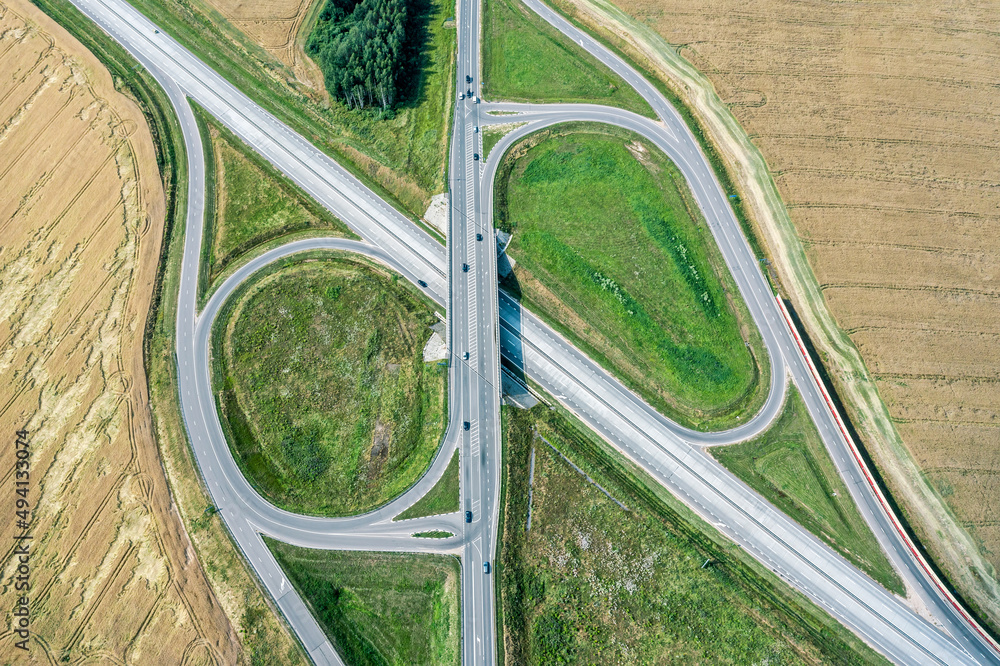 roundabout in the middle of agricultural grain fields. aerial view in summer time.