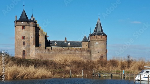 Muiderslot in Muiden, a medieval castle tangible history. Restoration undergo and tourist place by museums and sights. Historic building.
