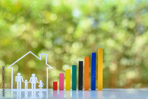 Household living cost / family trust concept : Family members, parents & child live in a house with increasing color bar graph, depicts rising in expense / cost of living and estate or inheritance tax