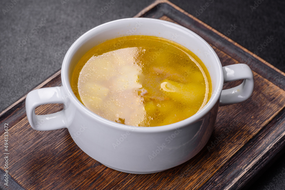 Fresh pea soup in bowl on black background. Cooking at home Fresh pea soup in bowl on black background. Cooking at home