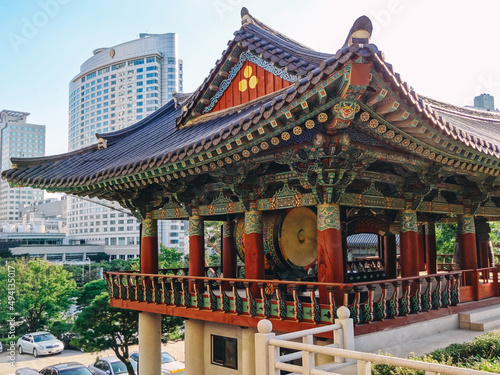 Nature, people and sights of Korea in Seoul. Temple against the backdrop of a modern city