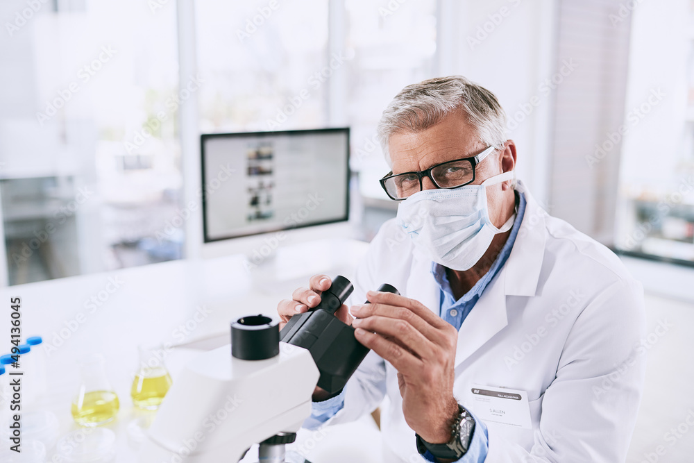 Science stimulates our natural curiosity of the world. Portrait of a mature scientist using a microscope in a lab. Science stimulates our natural curiosity of the world. Portrait of a mature scientist using a microscope in a lab.
