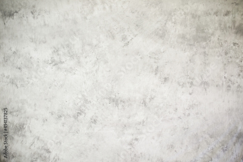 White grunge cement or concrete painted wall texture. The white concrete stone. concrete plastered stucco wall painted. White abstract gray background concrete texture for interior design.