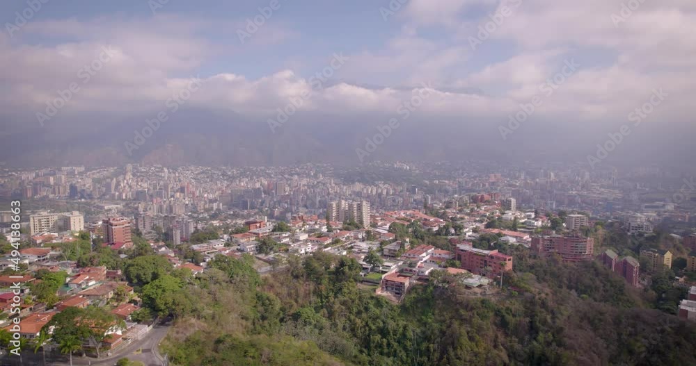 Aerial view of Caracas City, over Colinas de Bello Monte, looking to the Avila Mountain in the background. Aerial view of Caracas City, over Colinas de Bello Monte, looking to the Avila Mountain in the background.