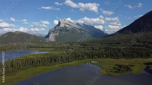 lake over a mountain with a train going through