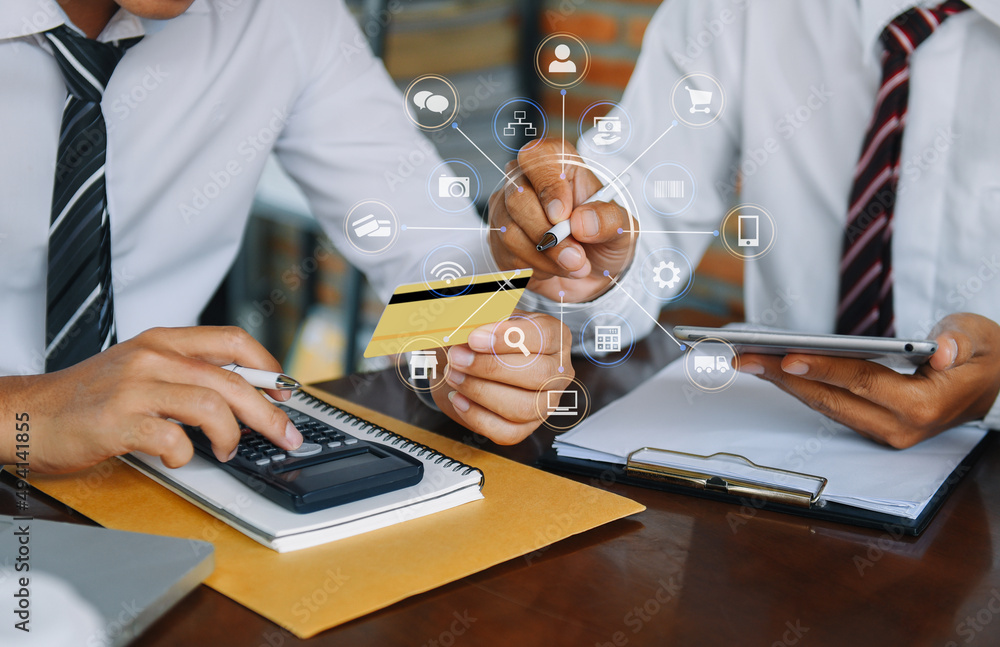 Fototapeta premium Business team using calculator with credit card for shopping internet online in office.