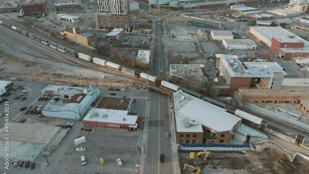 Aerial slow pan up of train over a bridge in downtown Nashville, TN. Aerial slow pan up of train over a bridge in downtown Nashville, TN.