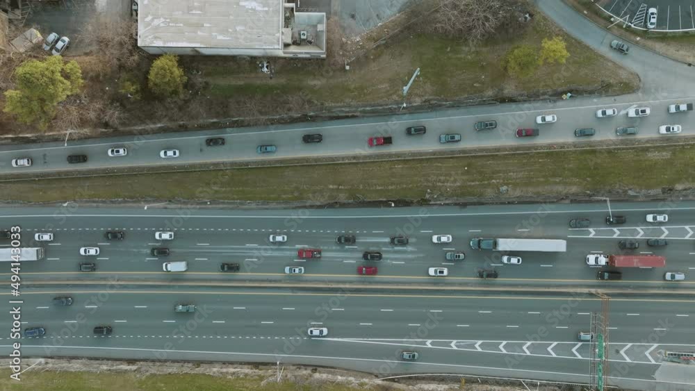 Slow static zoom out aerial of highway traffic. Slow static zoom out aerial of highway traffic.