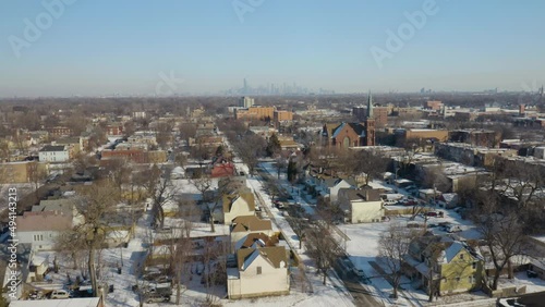 Drone Shot of South Side Neighborhood in Winter with Chicago Skyline in Background photo