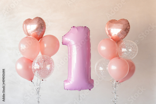 helium balloons for birthday. Greeting card. Holiday decoration. Background for invitation card. The child is 1 year old. Baby first year. Number one