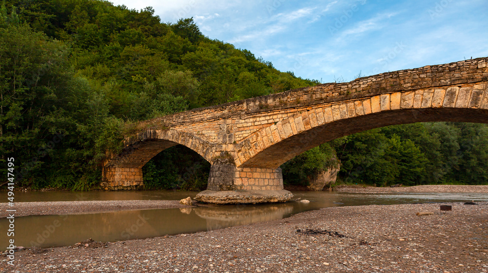 An ancient stone bridge in the foothills of the Caucasus. Republic of Adygea