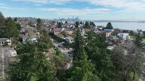 Cinematic 4K aerial drone reveal shot of Southeast Magnolia, Interbay, Carlton Park, Briarcliff, Smith Cove, coastal uptown neighborhoods with views of Seattle, Washington photo