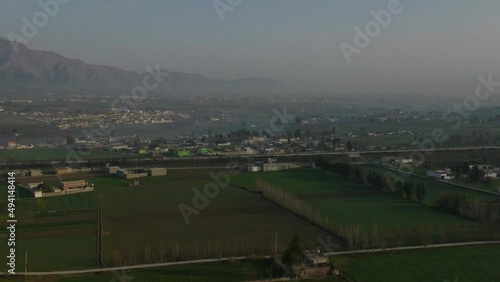 Aerial Drone Flying Over Rural Abbottabad Farm Fields Circle Dolly View Of Hazara M 15 Motorway  photo