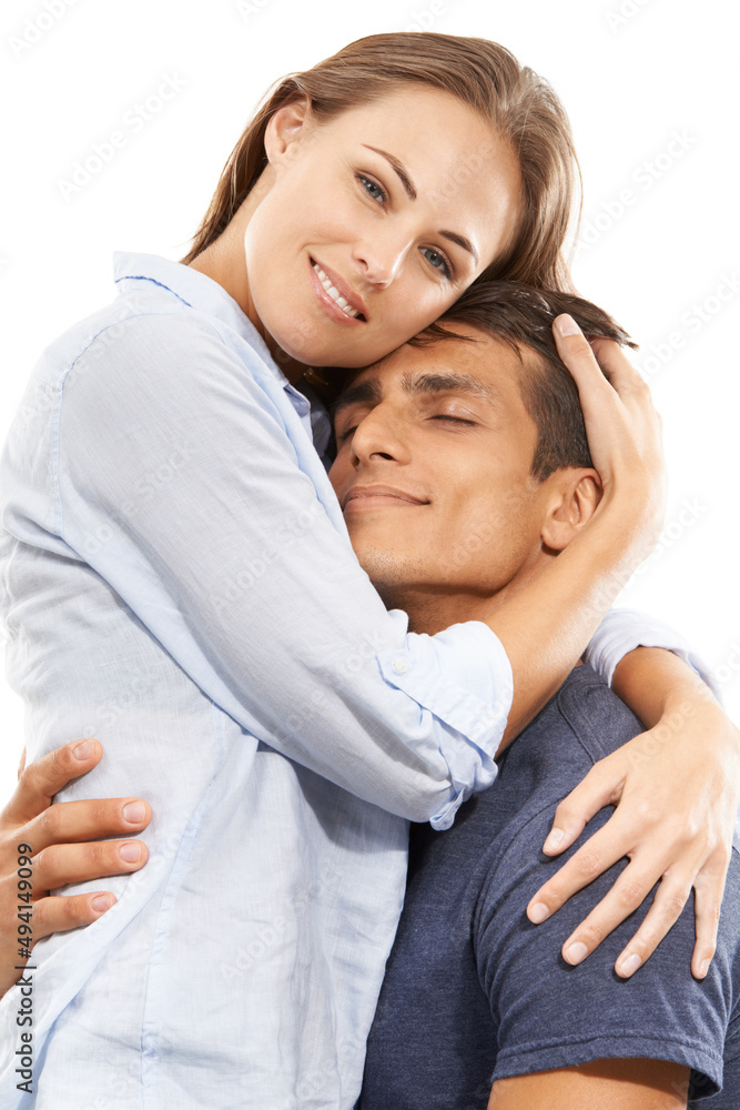 Hes all mine. A young couple embracing lovingly against a white background. Hes all mine. A young couple embracing lovingly against a white background.