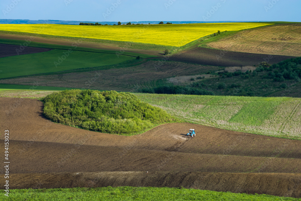 Fototapeta premium Agricultural machinery in a field