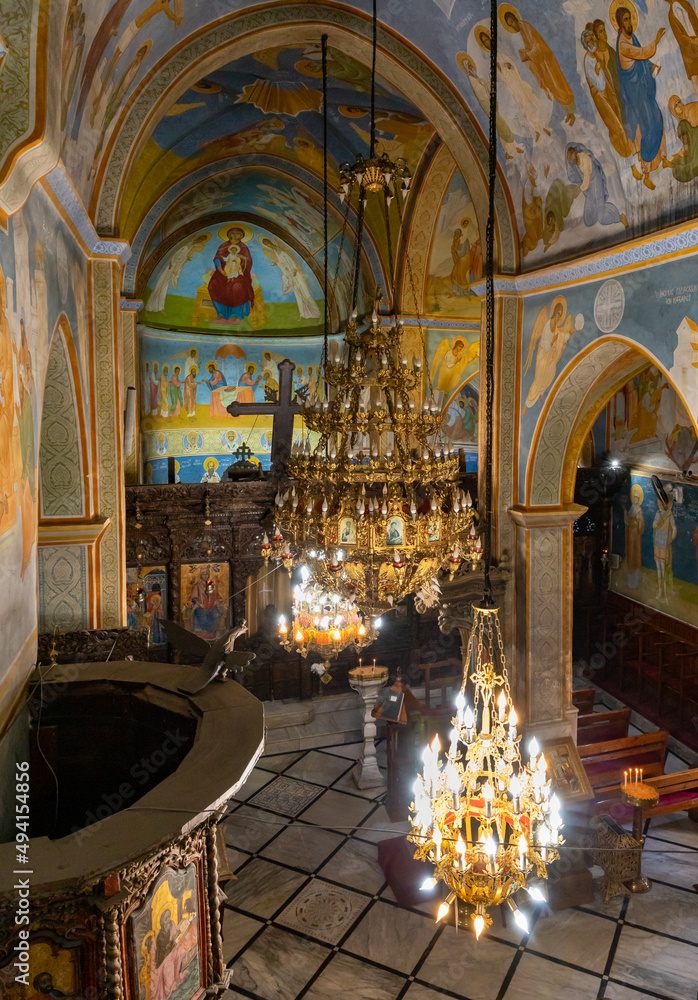 Large ornate chandeliers hang from the ceiling in the main hall of The Greek Orthodox Church of the Annunciation in the old part of Nazareth, northern Israel