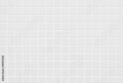 White ceramic wall and floor tile abstract background. Design geometric mosaic texture for backdrop hospital wall, canteen and kitchen.