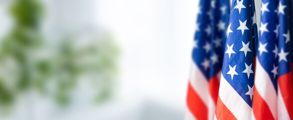 Group of American flags in green background.