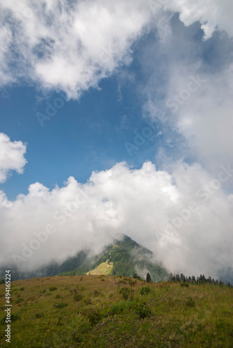 Mountain adorned with clouds. Hill surrounded by clouds. Mountain lost in fog. Kackar Mountains. Rize, Turkey.