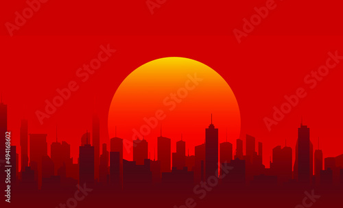 silhouette of the city of the future with skyscrapers on a red sky background and the setting sun