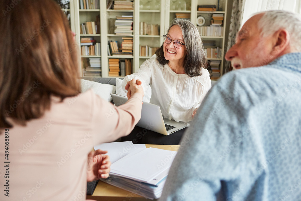 Financial advisor and seniors shaking hands Financial advisor and seniors shaking hands
