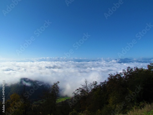 View of Gorenjska from Karavanke mountains in Slovenia covered white fullfy clouds on a clear day