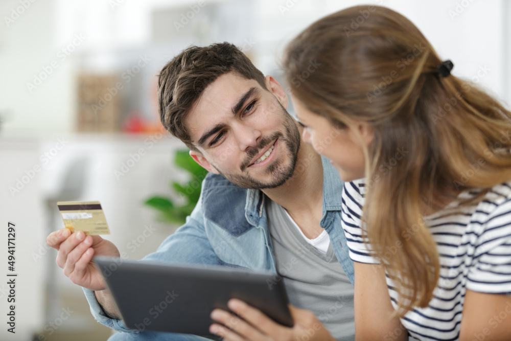 couple using card for online purchase couple using card for online purchase