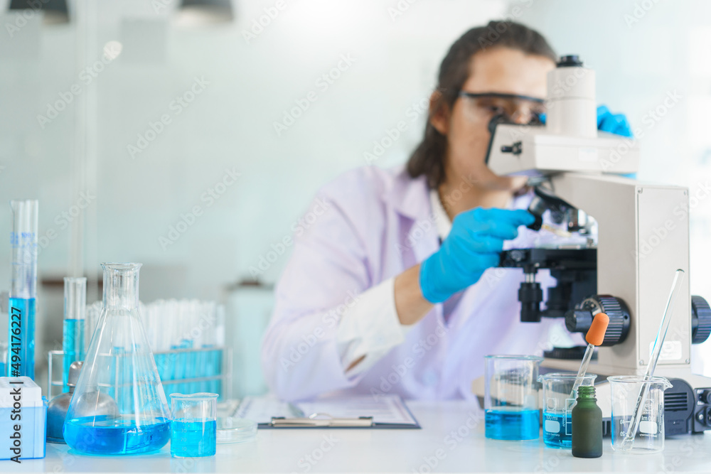 Laboratory research concept, Scientist using microscope to research and development of vaccine Laboratory research concept, Scientist using microscope to research and development of vaccine