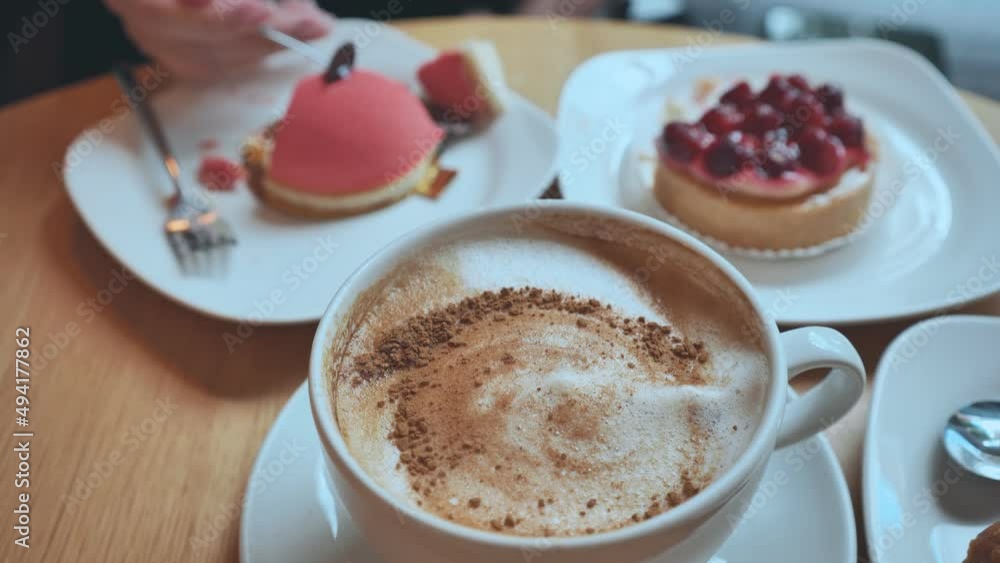 A table of cakes and coffee at a girl's breakfast. A table of cakes and coffee at a girl's breakfast.