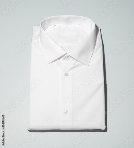 Classic light shirt with long sleeves on the background.