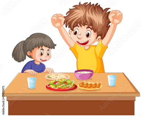Happy kids eating on the table