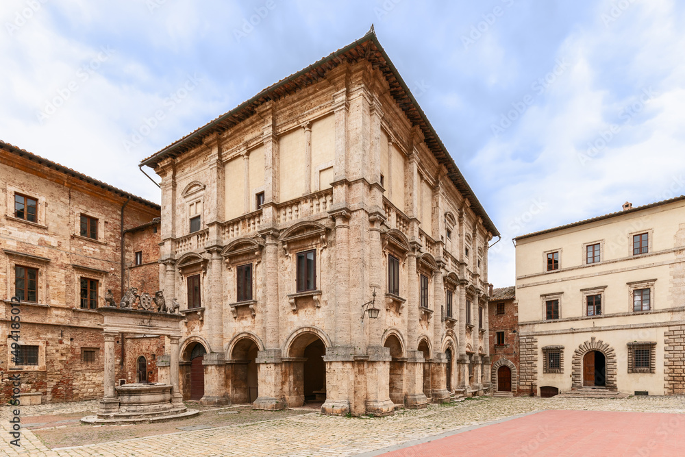 Renaissance Palazzo Nobili Tarugi and old marble well on the central Piazza Grande in Montepulciano, Tuscany, Italy